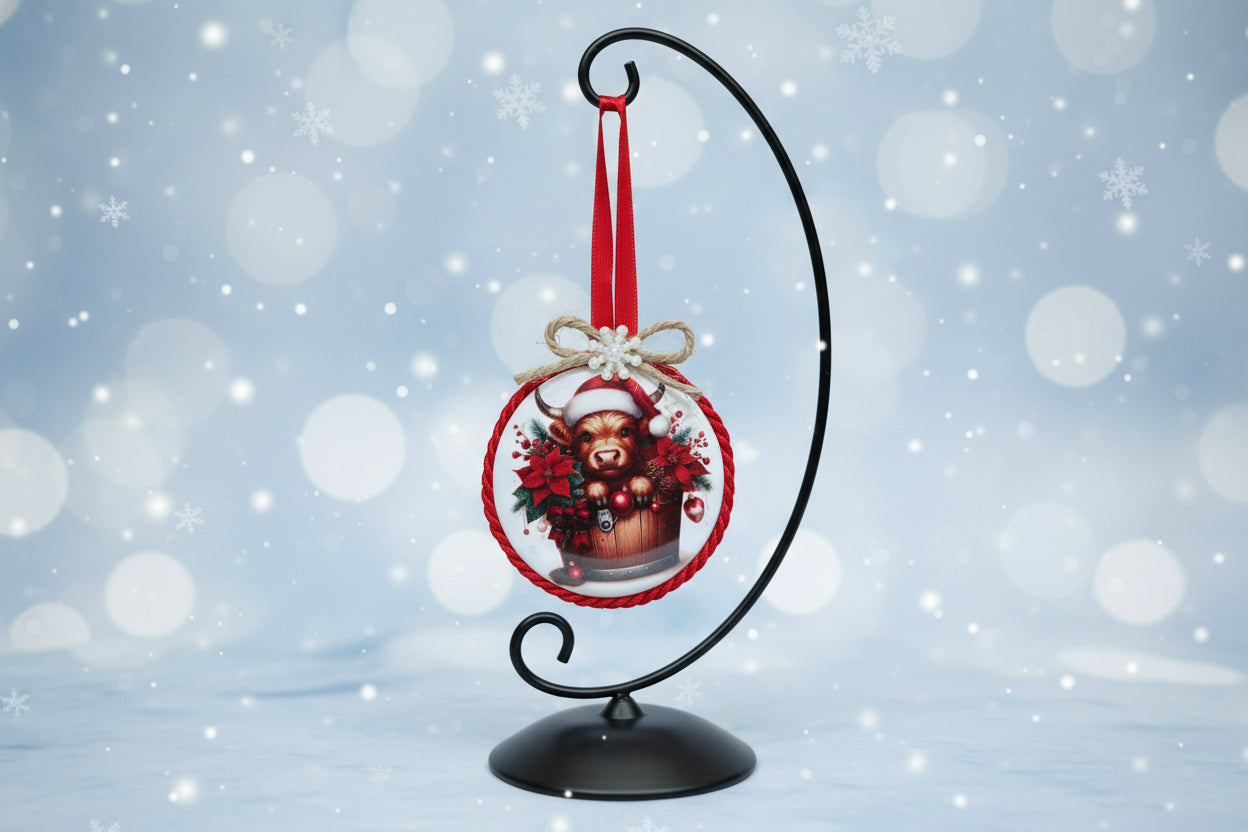 Christmas-themed ornament with a cow in a Santa hat on a white background