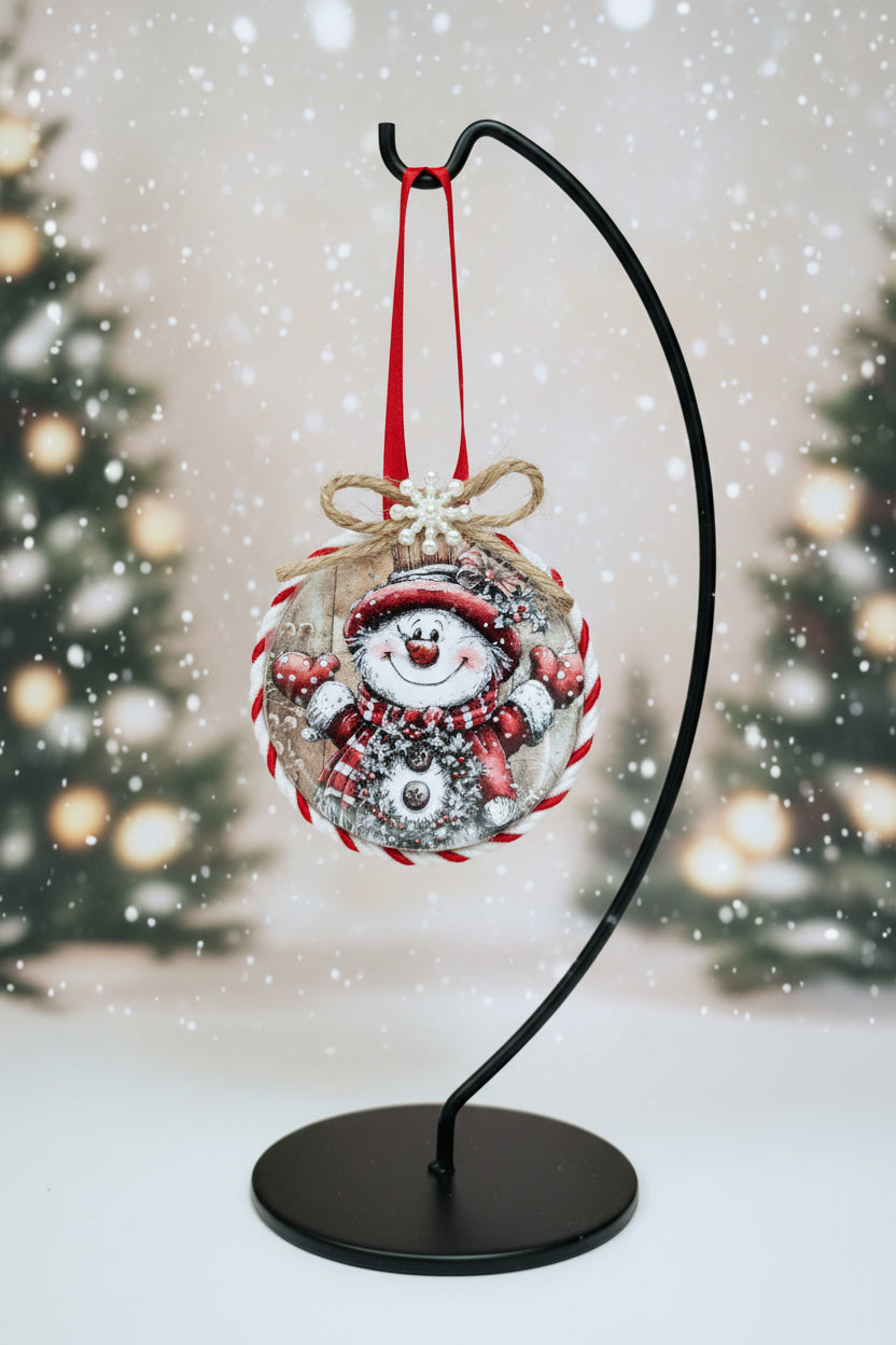 Christmas ornament with a snowman design on a white background